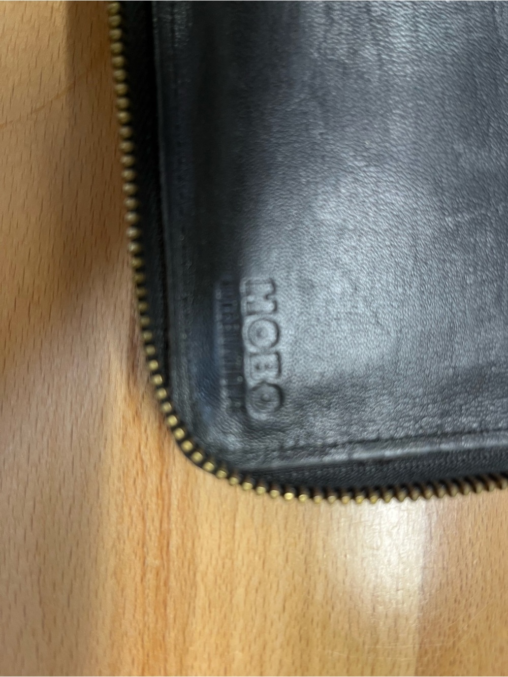 HOBO Black Leather Zip-Around Wallet with Brass Zipper